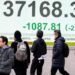 Stock market today: Asian shares skid, hit by Trump tariff hikes and doubts about AI